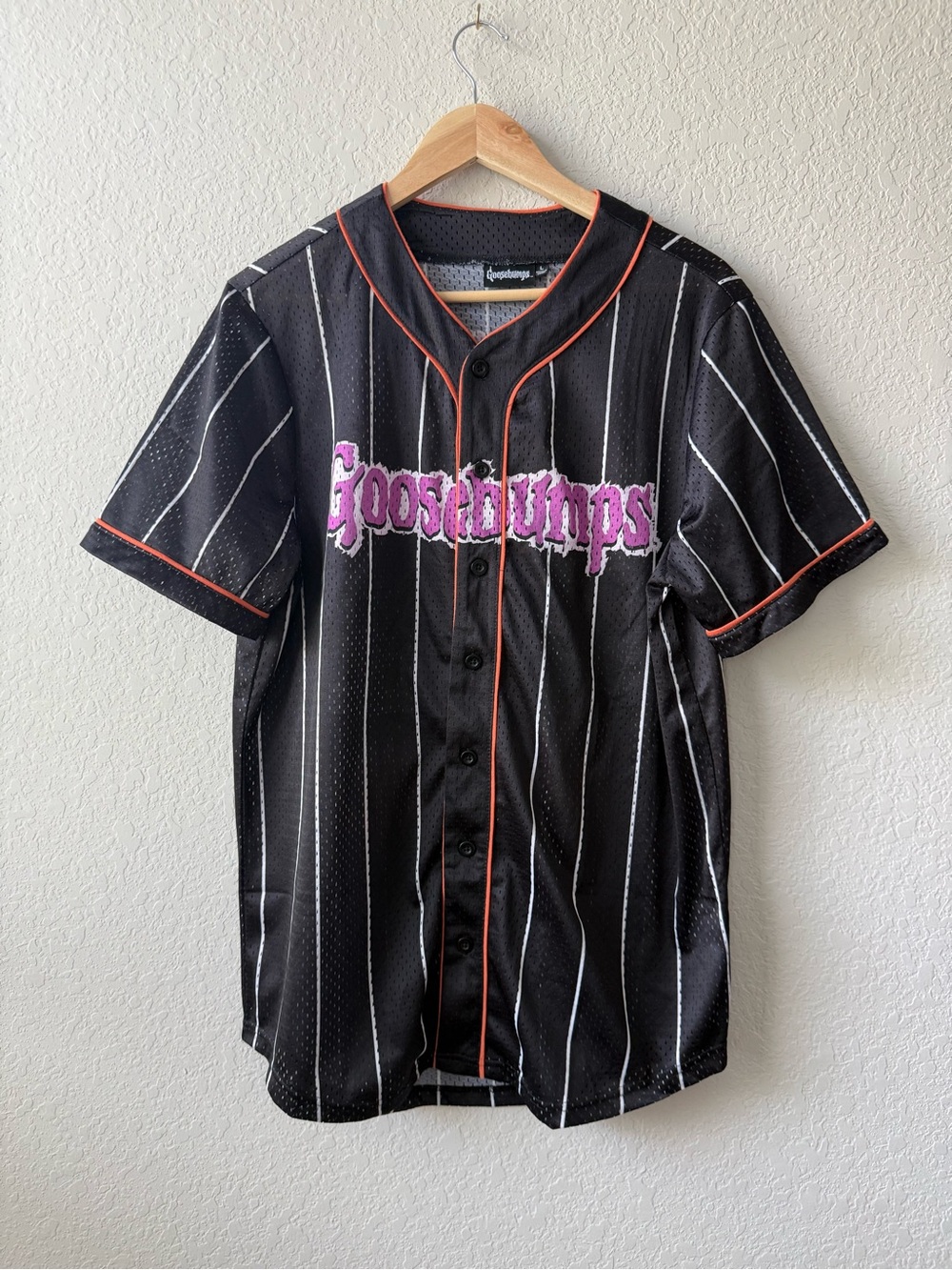 Goosebumps Black Pinstripe Baseball Jersey with Halloween Horrorland Graphic